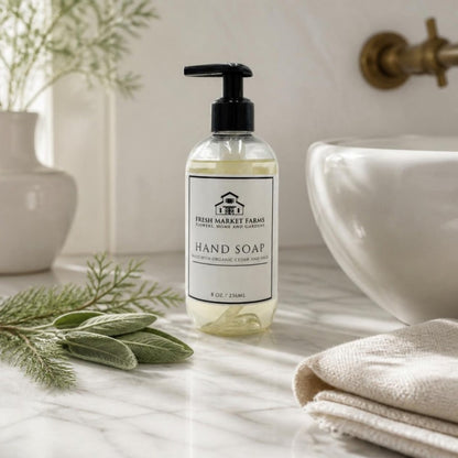 Cedar & Sage Hand Soap on a bathroom counter with cedar and sage
