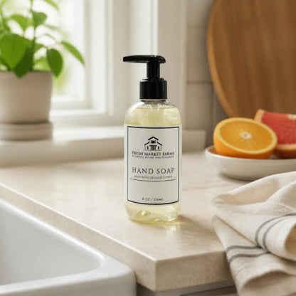 Citrus Hand Soap by a kitchen sink with fresh citrus
