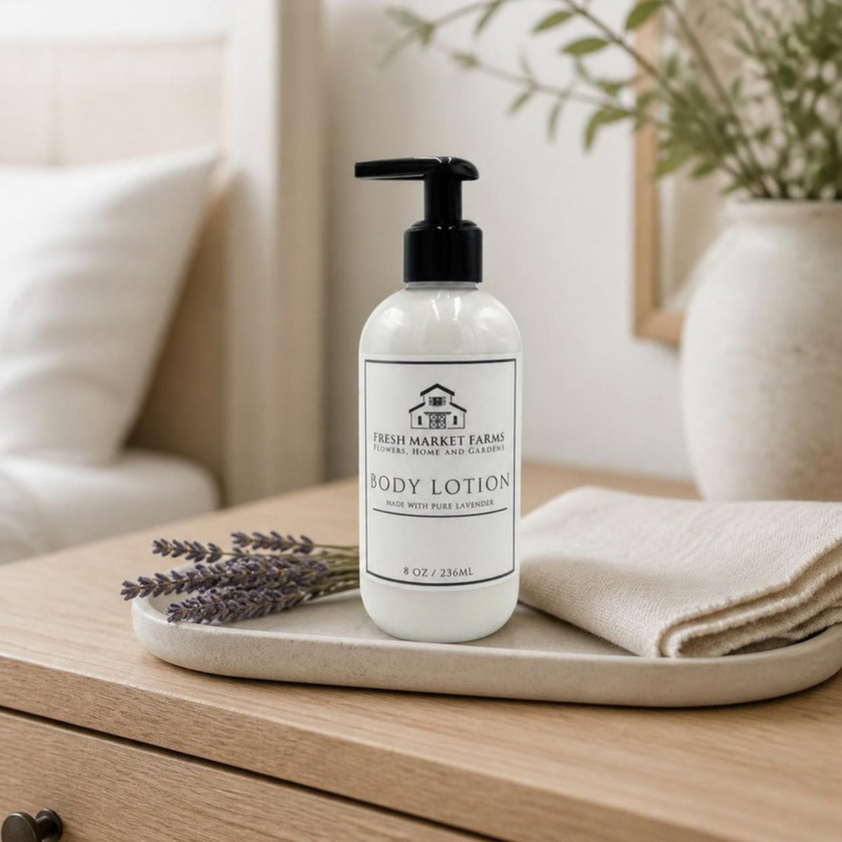 Lavender Body Lotion on a bedroom dresser with dried lavender