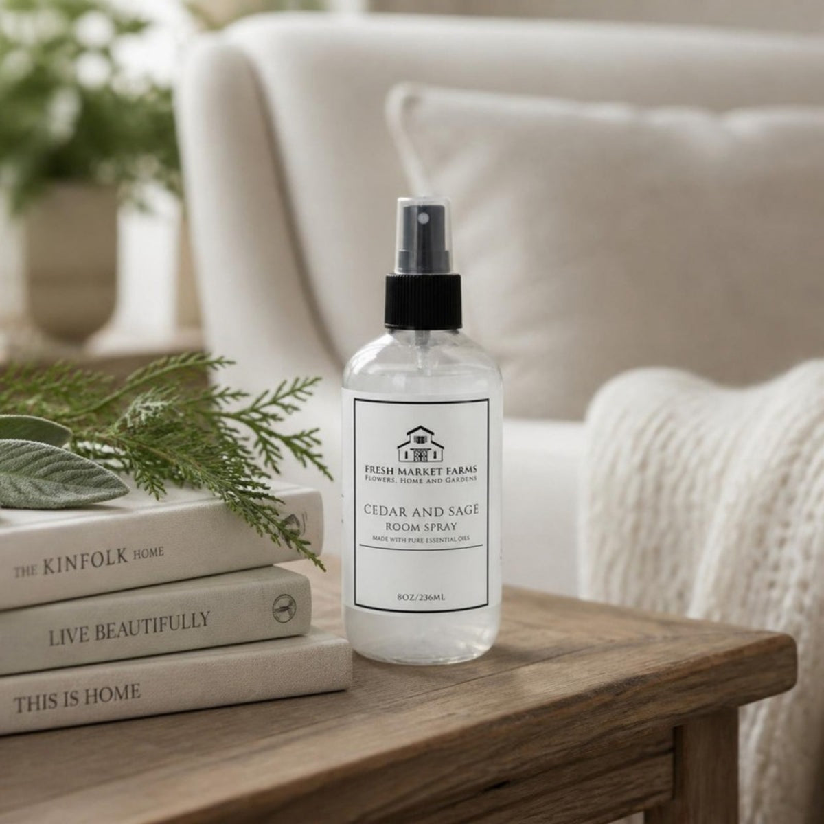 Cedar & Sage Room Spray on a living room side table