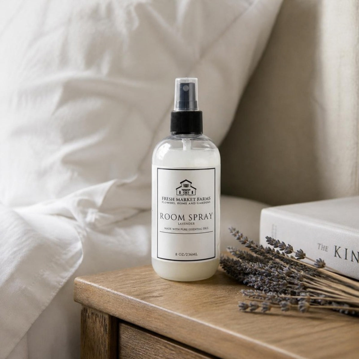 Lavender Room Spray on a bedside table with dried lavender