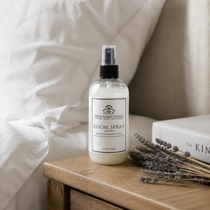 Lavender Room Spray on a bedside table with dried lavender